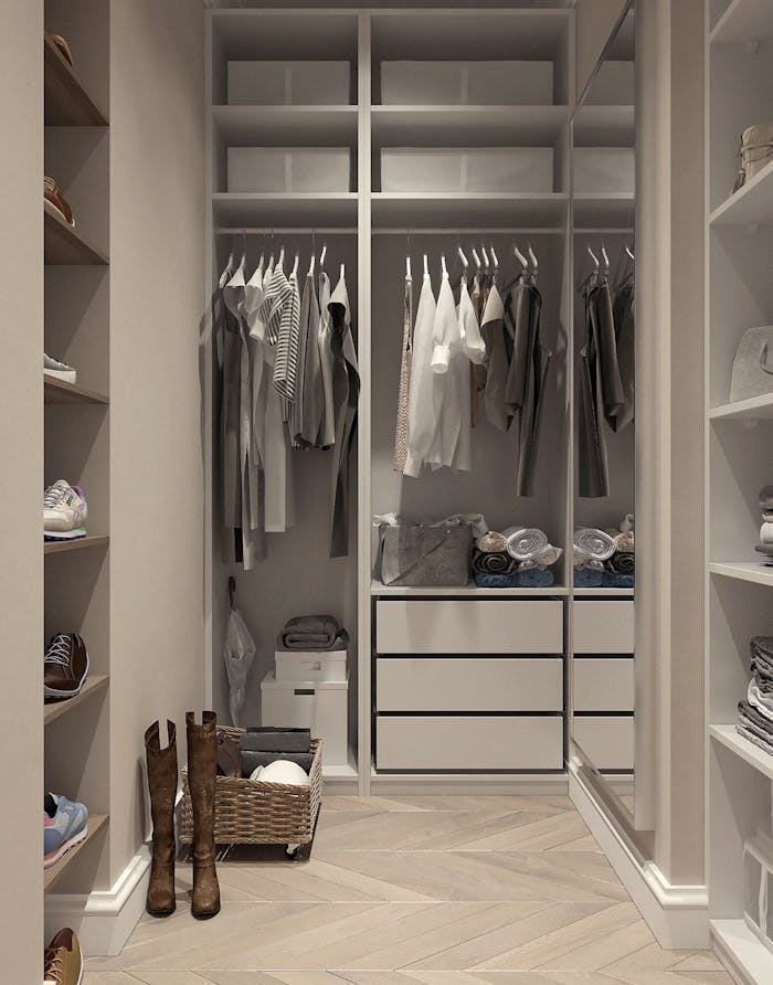 services-01 Stylish walk-in closet with neutral tones and contemporary design elements.